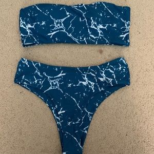 blue marble with white swimsuit